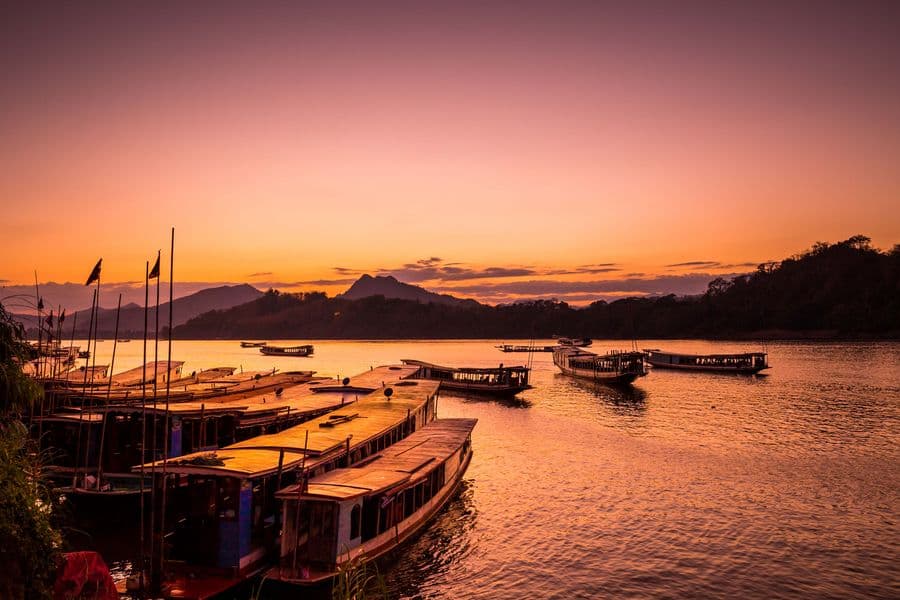 Aerial view of emerald Nam Song river winding through karst mountains in Laos